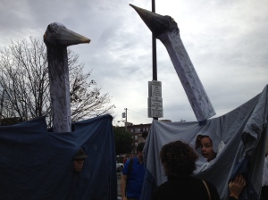 Two great blue heron backpack puppets at Honk! 2012.